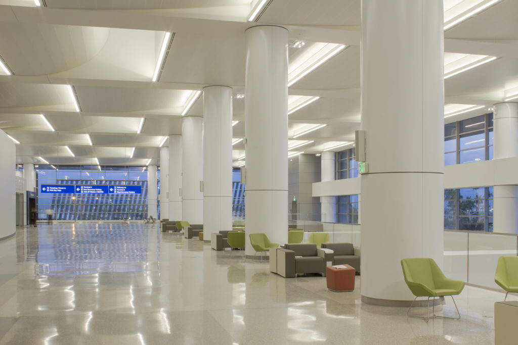 Multi-radius Torsion and Segmented Torsion Spring scalloped ceiling systems in a white finish were installed both flat and curved along the terminal’s upper floors to accommodate previously designed skylights.