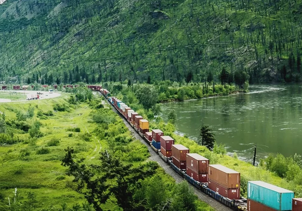 Supply chain illustration from BCG - cargo train traveling through beautiful landscape