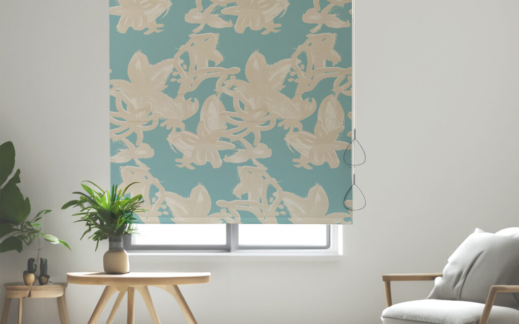 Newton Wand Chain-Free Solar Shade - a light-turquoise window shade with swirly beige bow pattern covering most of a window in a healthcare environment